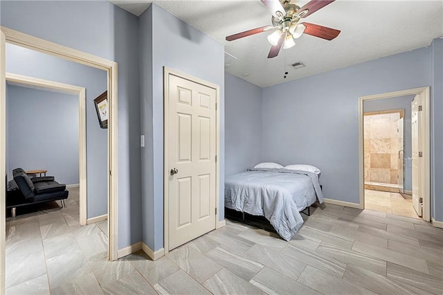 bedroom with ceiling fan and ensuite bathroom