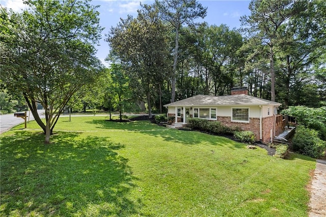 839 Cardova Dr NE, Atlanta, GA 30324 - view of green lawn featuring view of wooded area