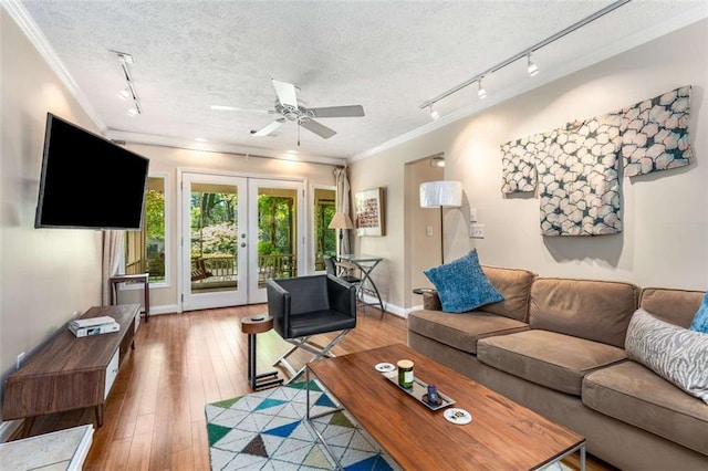 1071 Standard Dr NE, Brookhaven, GA 30319 - living area with track lighting, a ceiling fan, ornamental molding, a textured ceiling, and hardwood / wood-style floors