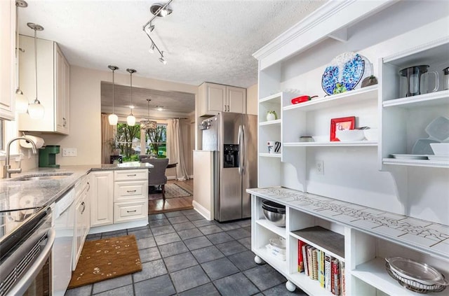 1071 Standard Dr NE, Brookhaven, GA 30319 - kitchen with stainless steel appliances, open shelves, a sink, decorative light fixtures, and a peninsula