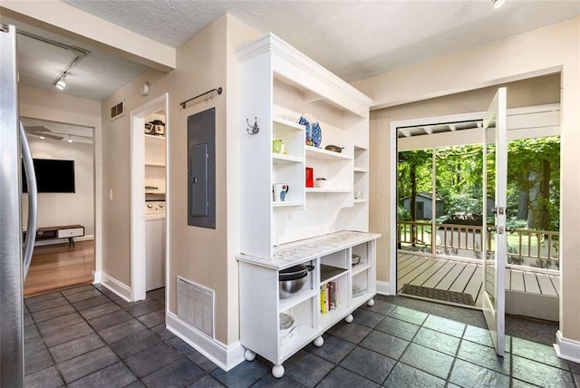 1071 Standard Dr NE, Brookhaven, GA 30319 - mudroom featuring baseboards, track lighting, electric panel, and a textured ceiling