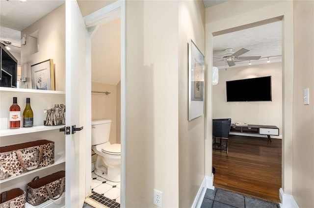 1071 Standard Dr NE, Brookhaven, GA 30319 - bathroom with ceiling fan, toilet, and tile patterned flooring