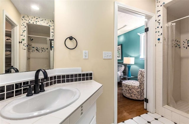 1071 Standard Dr NE, Brookhaven, GA 30319 - full bathroom featuring ensuite bath, a stall shower, vanity, and wood finished floors