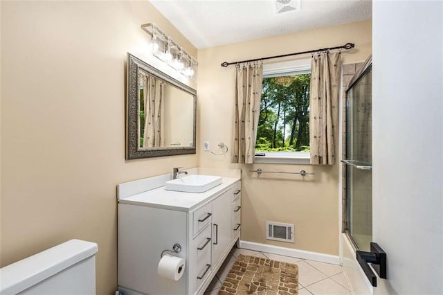 1071 Standard Dr NE, Brookhaven, GA 30319 - full bathroom featuring toilet, vanity, tile patterned floors, enclosed tub / shower combo, and baseboards
