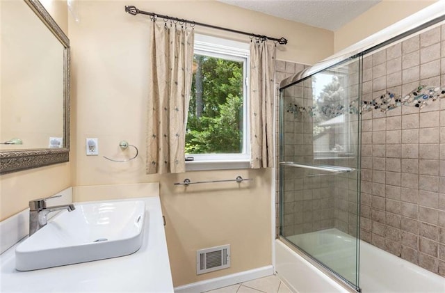 1071 Standard Dr NE, Brookhaven, GA 30319 - full bathroom featuring combined bath / shower with glass door, tile patterned floors, vanity, and a textured ceiling