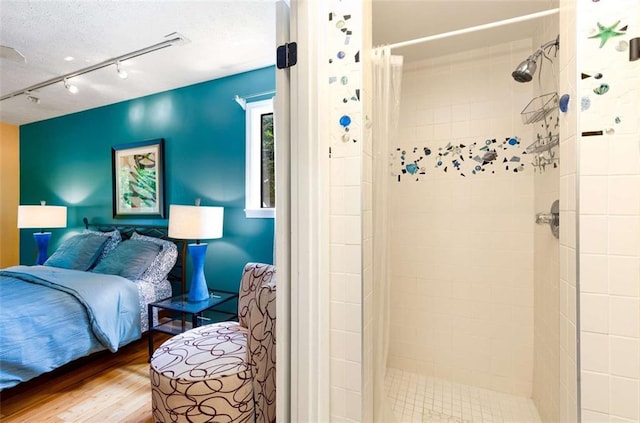1071 Standard Dr NE, Brookhaven, GA 30319 - bedroom featuring wood finished floors and track lighting