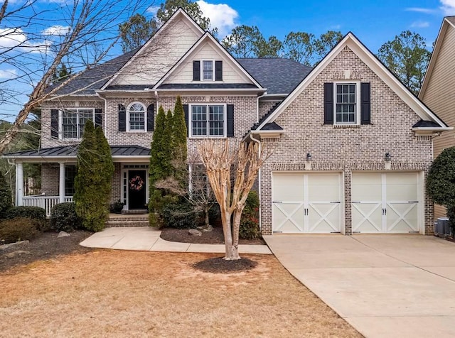 view of front of house featuring concrete driveway, an attached garage, covered porch, central air condition unit, and brick siding