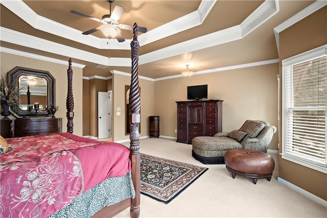 bedroom with ornamental molding, multiple windows, carpet, and a raised ceiling