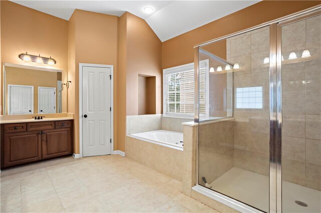 bathroom featuring lofted ceiling, a shower stall, vanity, and a bath