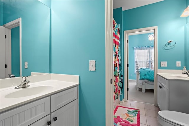 full bath featuring toilet, vanity, ensuite bath, and tile patterned floors