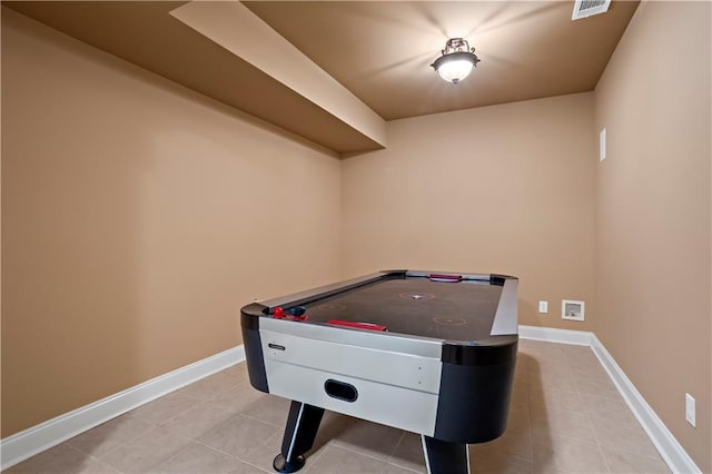 game room with visible vents, baseboards, and light tile patterned flooring