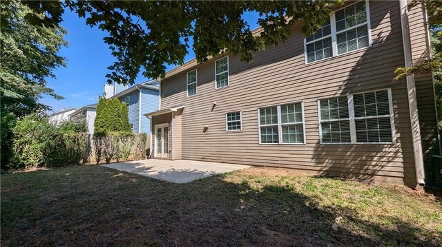 back of house with a patio