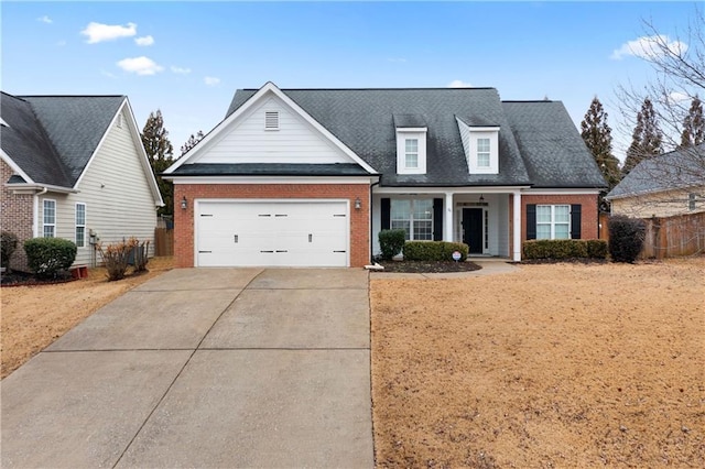 view of front of property with a garage and covered porch