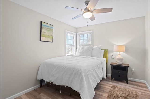 bedroom with wood-type flooring and ceiling fan