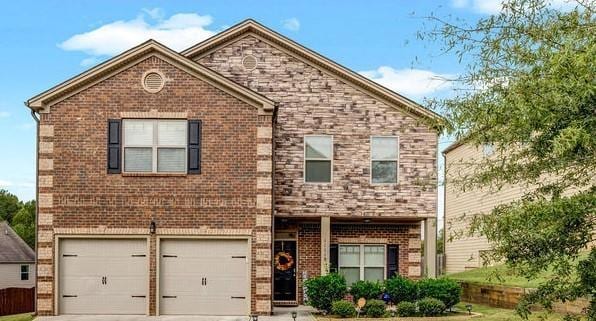 front facade with a garage