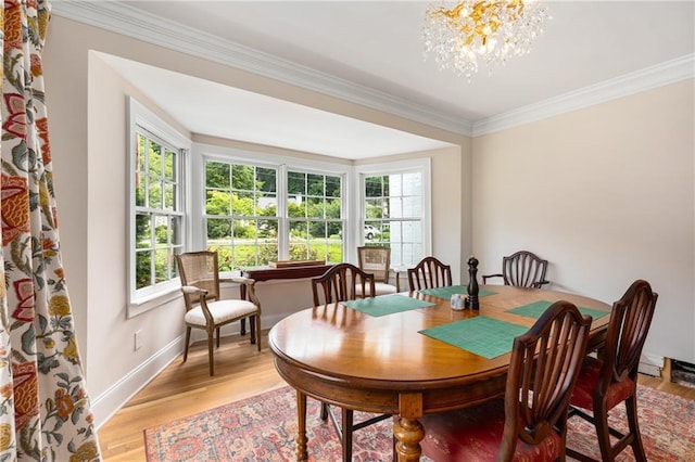 711 Greenview Ave NE, Atlanta, GA 30305 - dining room with crown molding, healthy amount of natural light, light wood finished floors, and a chandelier