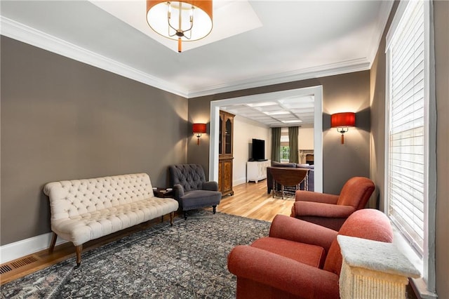 711 Greenview Ave NE, Atlanta, GA 30305 - living area featuring wood finished floors, baseboards, crown molding, and a fireplace