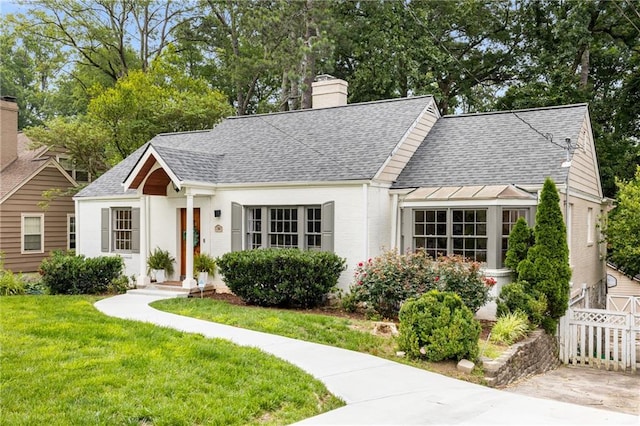 711 Greenview Ave NE, Atlanta, GA 30305 - view of front of property featuring roof with shingles and a chimney