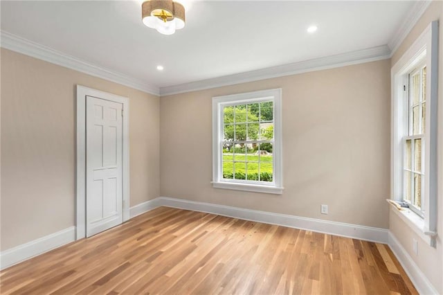 711 Greenview Ave NE, Atlanta, GA 30305 - unfurnished room with light wood-style flooring, crown molding, baseboards, and recessed lighting