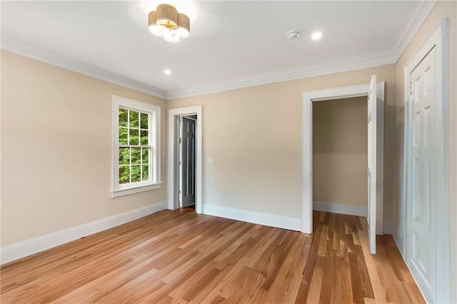 711 Greenview Ave NE, Atlanta, GA 30305 - unfurnished bedroom featuring baseboards, crown molding, light wood finished floors, a closet, and recessed lighting