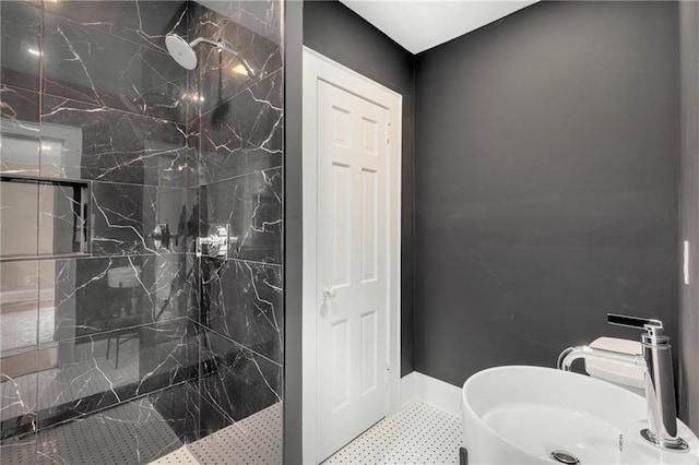 711 Greenview Ave NE, Atlanta, GA 30305 - bathroom featuring a sink, a marble finish shower, and baseboards