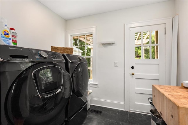 711 Greenview Ave NE, Atlanta, GA 30305 - washroom with washing machine and clothes dryer and baseboards