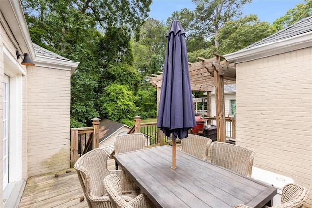 711 Greenview Ave NE, Atlanta, GA 30305 - wooden terrace featuring outdoor dining space, a pergola, and view of wooded area