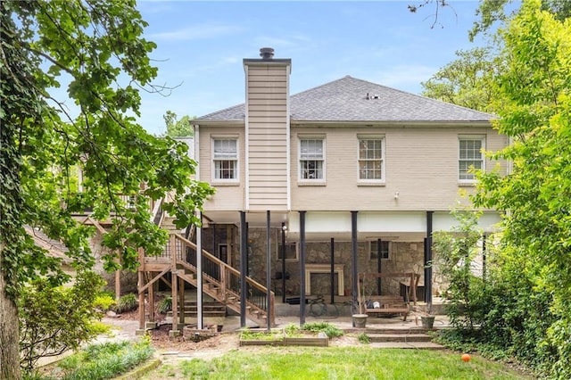 711 Greenview Ave NE, Atlanta, GA 30305 - back of house featuring a patio area, a chimney, a shingled roof, stairway, and stone siding