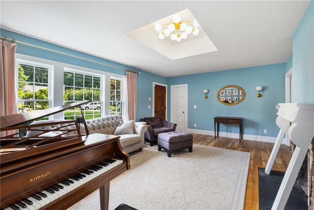 711 Greenview Ave NE, Atlanta, GA 30305 - living room featuring a skylight, wood finished floors, healthy amount of natural light, and baseboards