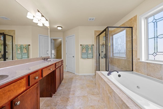 bathroom with separate shower and tub and vanity