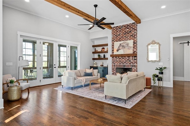 2208 Sage Mountain Ct SW, Marietta, GA 30064 - living room featuring wood finished floors, a ceiling fan, beam ceiling, a fireplace, and recessed lighting