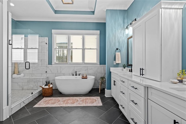 2208 Sage Mountain Ct SW, Marietta, GA 30064 - bathroom featuring a stall shower, a freestanding tub, double vanity, tile patterned flooring, and ornamental molding