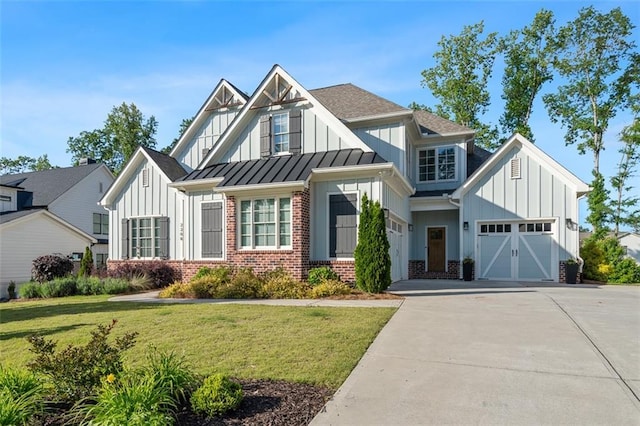 2208 Sage Mountain Ct SW, Marietta, GA 30064 - view of front facade featuring board and batten siding, brick siding, driveway, and a front lawn
