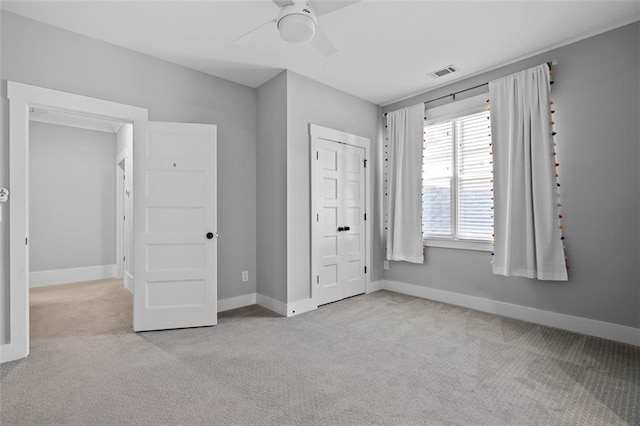 2208 Sage Mountain Ct SW, Marietta, GA 30064 - unfurnished bedroom with carpet floors, a ceiling fan, and a closet