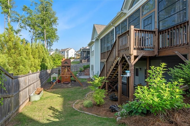 2208 Sage Mountain Ct SW, Marietta, GA 30064 - fenced backyard with a playground, a wooden deck, and stairway