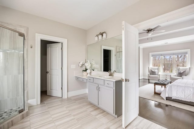 bathroom with walk in shower, ceiling fan, and vanity