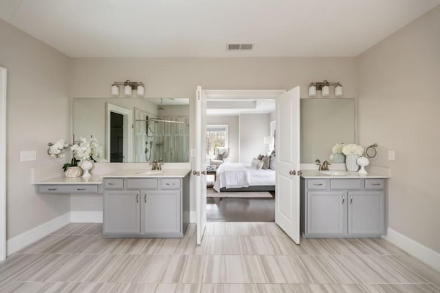 bathroom with walk in shower and vanity