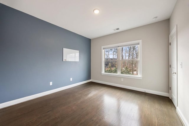 empty room with wood-type flooring