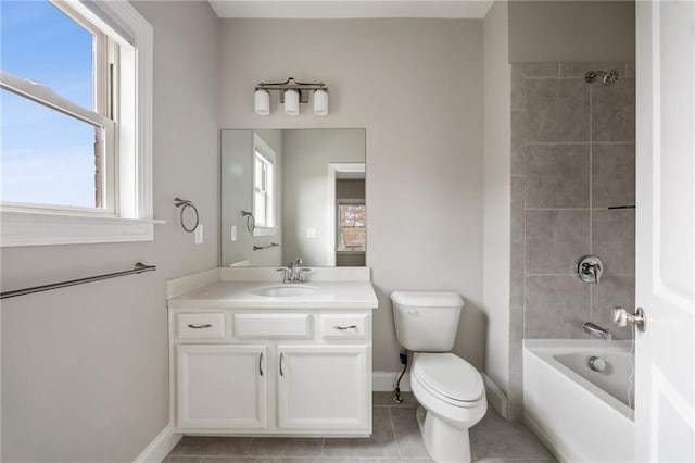 full bathroom featuring vanity, tiled shower / bath, tile patterned flooring, and toilet