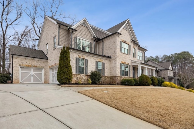 view of front facade with a garage and a front yard