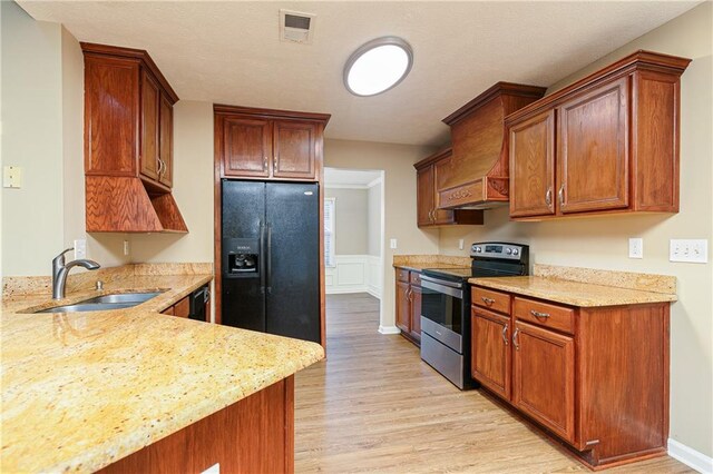 1731 Silverchase SW, Marietta, GA 30008 - kitchen featuring a sink, light stone counters, black appliances, and visible vents