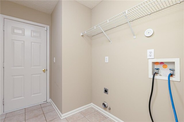 1731 Silverchase SW, Marietta, GA 30008 - clothes washing area with gas dryer hookup, hookup for a washing machine, laundry area, hookup for an electric dryer, and light tile patterned floors
