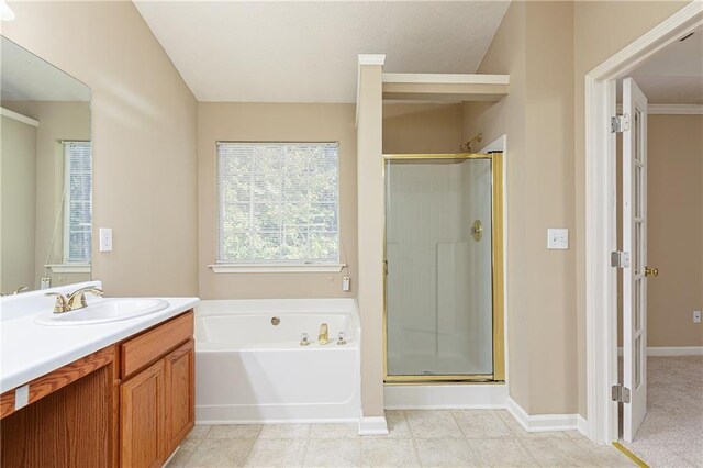 1731 Silverchase SW, Marietta, GA 30008 - full bath featuring a shower stall, baseboards, vanity, and a garden tub