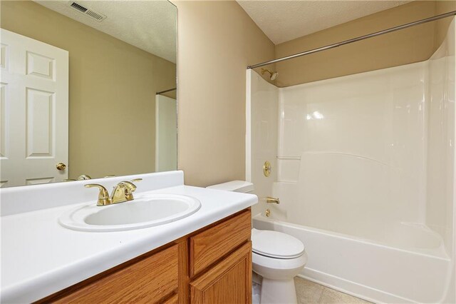 1731 Silverchase SW, Marietta, GA 30008 - bathroom featuring a textured ceiling, visible vents, toilet, vanity, and shower / bathtub combination