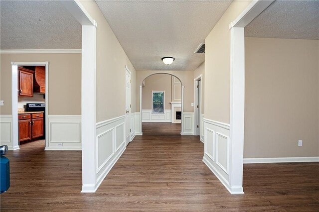 1731 Silverchase SW, Marietta, GA 30008 - hallway with dark wood finished floors, visible vents, arched walkways, and a textured ceiling