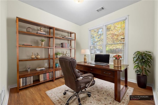 home office featuring light hardwood / wood-style flooring