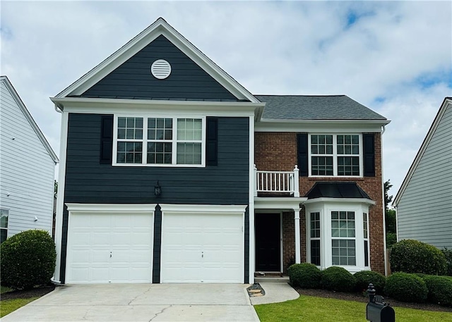 535 Watercress Dr, Woodstock, GA 30188 - view of front of property with a balcony, concrete driveway, an attached garage, and brick siding