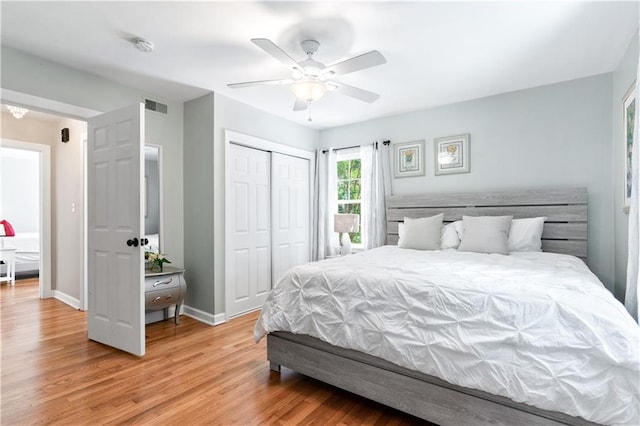 1359 Scott Blvd, Decatur, GA 30030 - bedroom with light wood-style flooring, a closet, baseboards, and ceiling fan