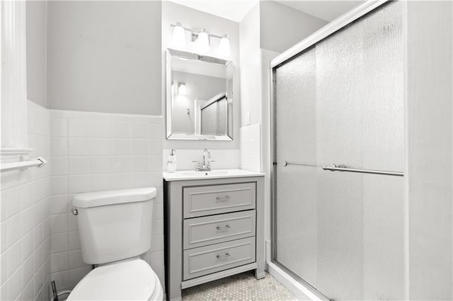 1359 Scott Blvd, Decatur, GA 30030 - bathroom featuring toilet, a shower stall, vanity, wainscoting, and tile walls