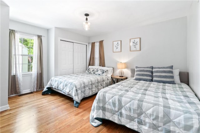 1359 Scott Blvd, Decatur, GA 30030 - bedroom featuring light wood-type flooring, a closet, and baseboards